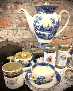 Teapot and teacups with tea accessories staged at the Fort Gibson gift shop